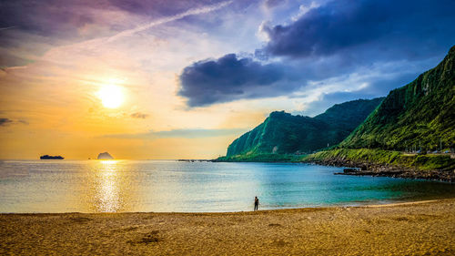 Scenic view of sea against sky during sunset