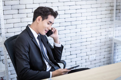 Young man using mobile phone