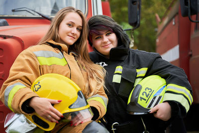 Portrait of smiling firefighters