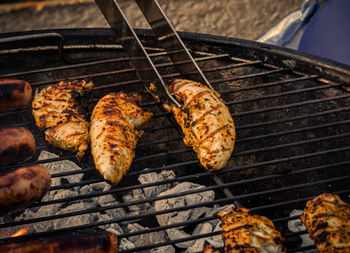 High angle view of meat on barbecue grill