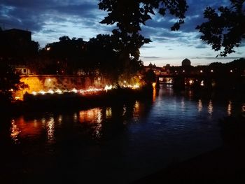 Scenic view of river against sky at night