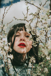 Portrait of woman against plants