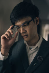 Close-up of young man wearing eyeglasses