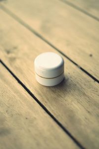 High angle view of container on wooden table