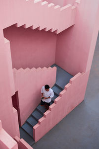 High angle view of people standing on staircase