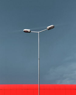 Low angle view of street light against sky