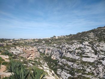 Scenic view of rocky mountains against sky