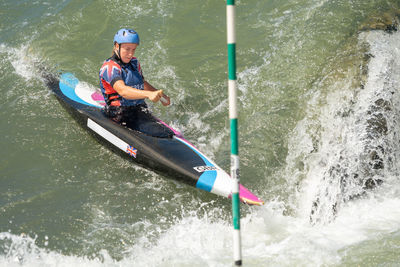 Man surfing on boat in water