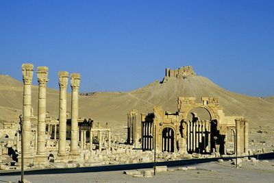 Panoramic view of temple against clear blue sky