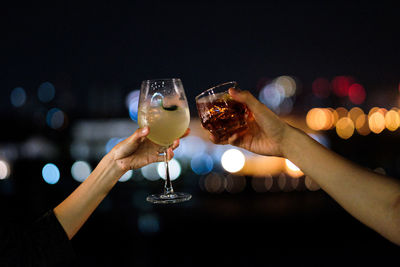 Midsection of man drinking glass