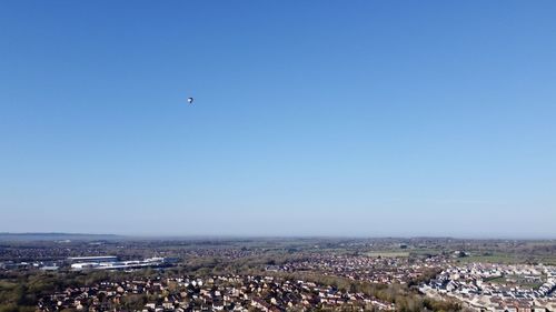 High angle shot of townscape against clear blue sky