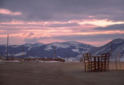 Scenic view of snowcapped mountains against sky during sunset