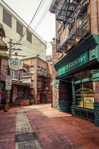 Street amidst buildings in city against sky