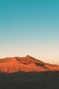 Scenic view of desert against clear sky