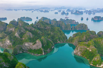 High angle view of rocks and sea against sky