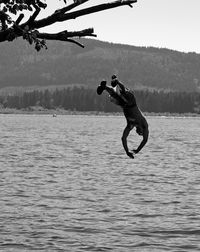 Man diving in to lake