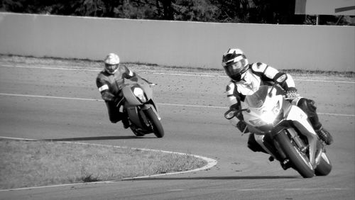 Man riding motorcycle on road