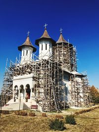 Low angle view of traditional building against clear blue sky