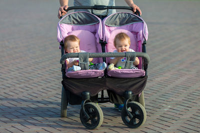 Side view of people in shopping cart