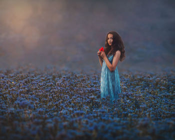 Full length of a woman standing on field