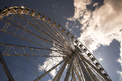 Low angle view of ferris wheel against sky