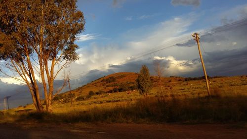 Scenic view of mountains against cloudy sky