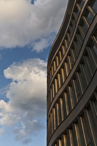 Low angle view of building against cloudy sky