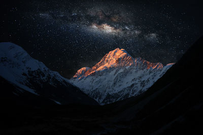 Scenic view of snow covered mountain against sky