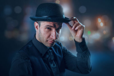 Portrait of young man wearing hat