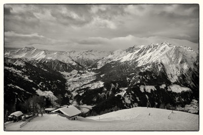 Scenic view of snowcapped mountains against sky
