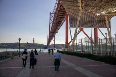 People walking on bridge