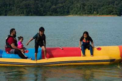 People on boat in lake