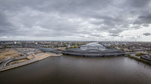 High angle view of cityscape against cloudy sky