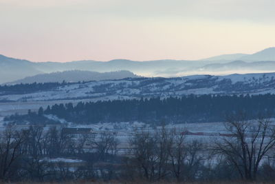 Scenic view of mountains against sky during sunset