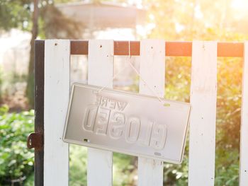 Close-up of text on wooden fence
