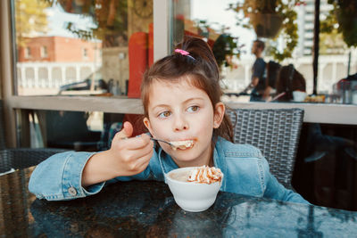 Portrait of boy eating food