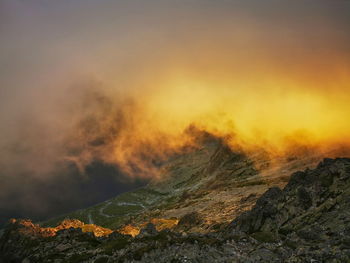 Scenic view of mountain against sky during sunset