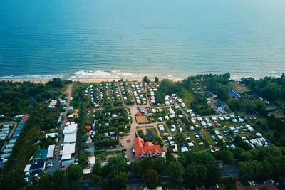 Aerial view of campsite with trailers near baltic sea beach in wladyslawowo, poland