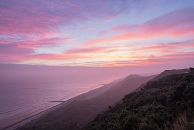 Scenic view of sunset over beach