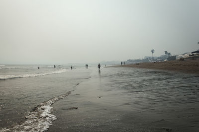 Scenic view of beach against clear sky