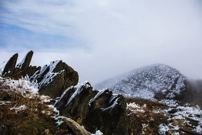 Scenic view of mountains against sky during winter