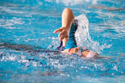 Boy swimming in pool