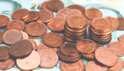 High angle view of coins on table