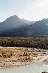 Scenic view of landscape and mountains against sky