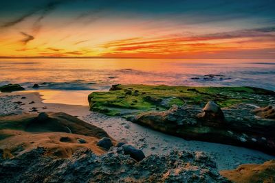 Scenic view of sea against sky at sunset