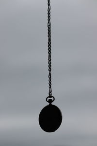 Low angle view of swing against sky