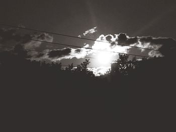 Low angle view of power lines against sky