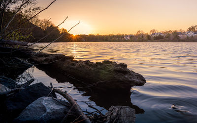 Scenic view of lake against sky during sunset