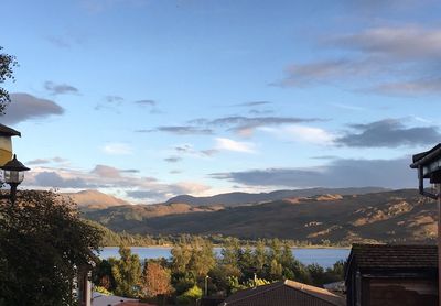 High angle view of calm lake against mountain range