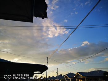 Low angle view of silhouette buildings against sky during sunset